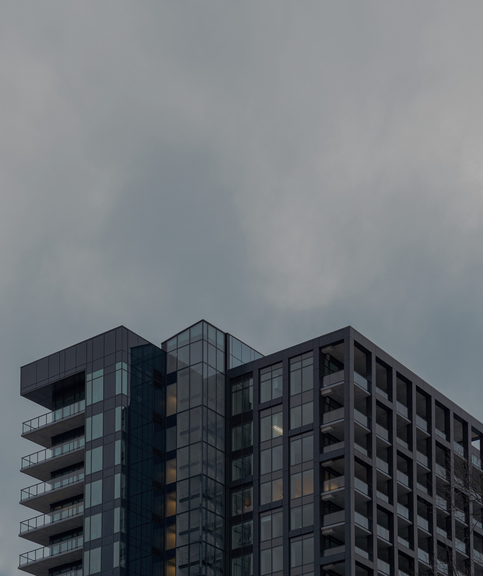 Modern multistage house exterior under cloudy sky in city